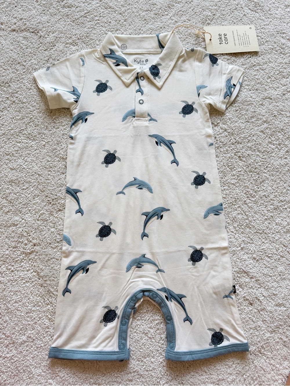 Kyte BABY Cream Short Sleeve Romper with Blue Dolphins & Navy Turtles